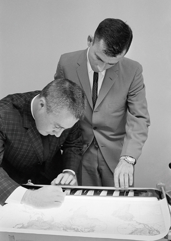A man is writing on the keyboard of an electronic piano.