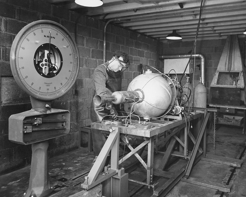 A man working on an object in a room.