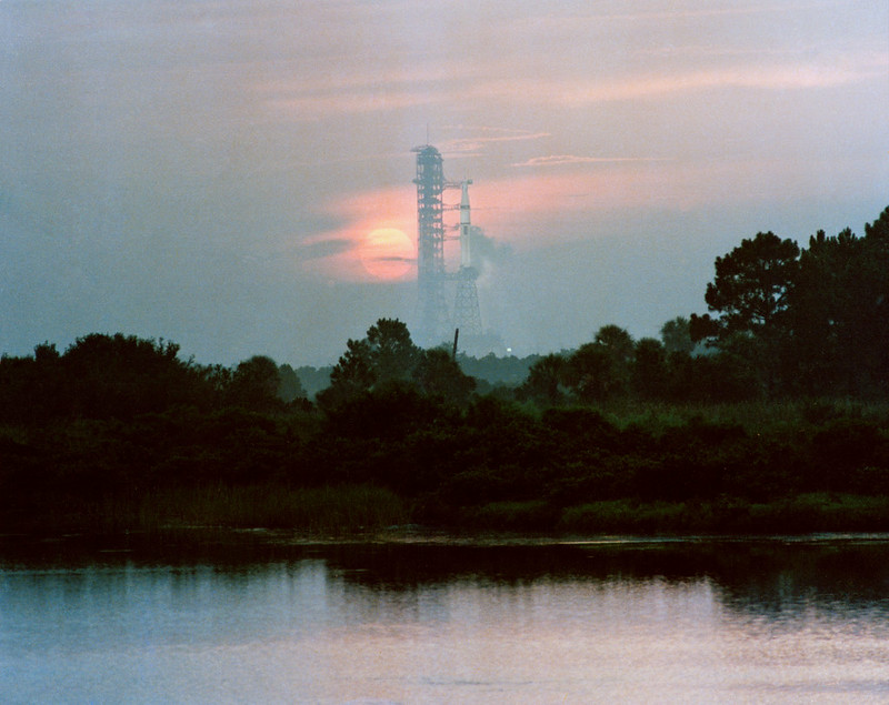 A view of the sun setting over a river.