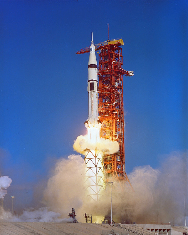 A rocket is being launched from the ground.