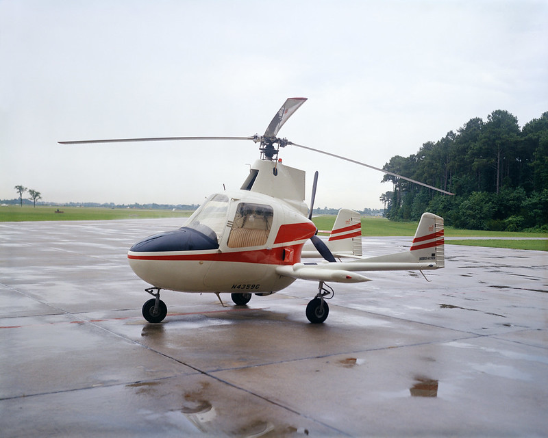 A helicopter sitting on top of an airport runway.